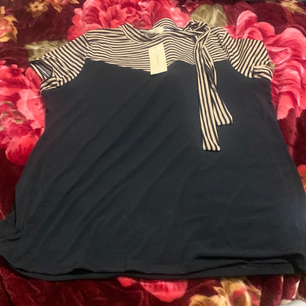 This shirt is brand new shirt the color of this shirt is tan and black